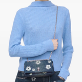 Blue bag worn by a person, showing the bag fit