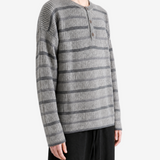 Grey shirt worn by a person, showing the shirt fit