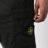 Close up of black shorts, showing texture of the elastane and cotton fabric