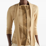 Tan shirt worn by a person, showing the shirt fit