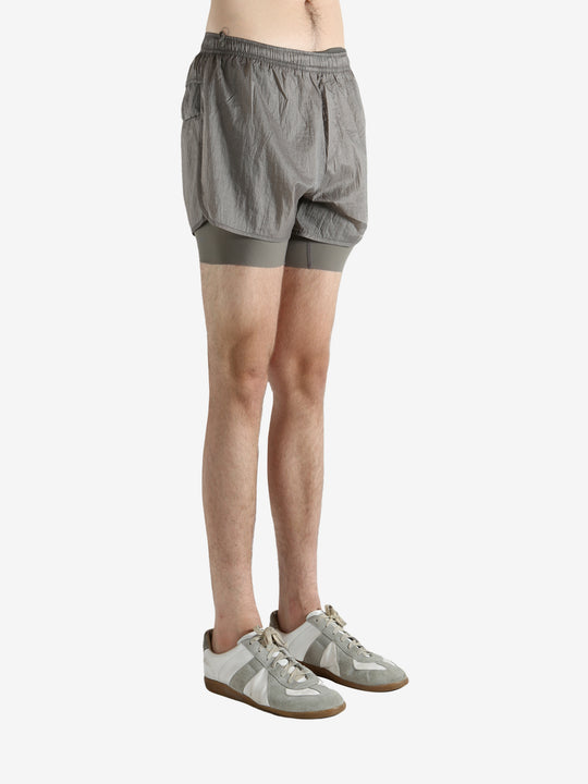 Grey shorts worn by a person, showing the shorts fit