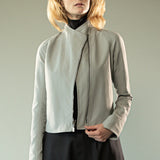 Grey jacket worn y a person, showing the jacket's fit