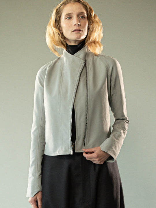 Grey jacket worn y a person, showing the jacket's fit