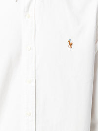 Close up of white shirt, showing texture of the cotton fabric 