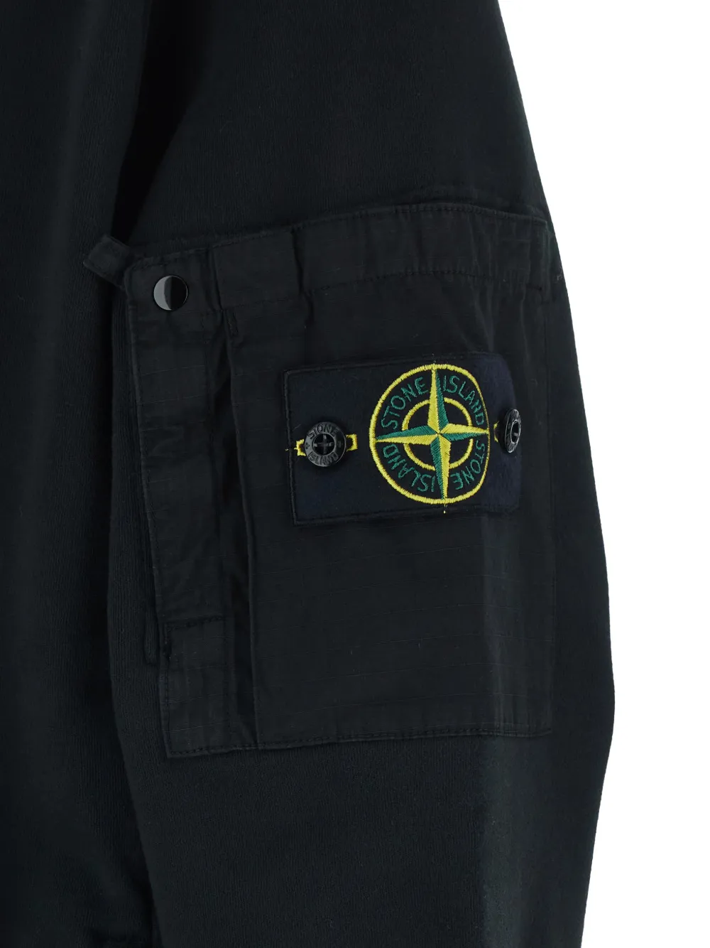 Close up of Black cardigan, showing texture of the cotton fabric
