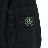 Close up of Black cardigan, showing texture of the cotton fabric