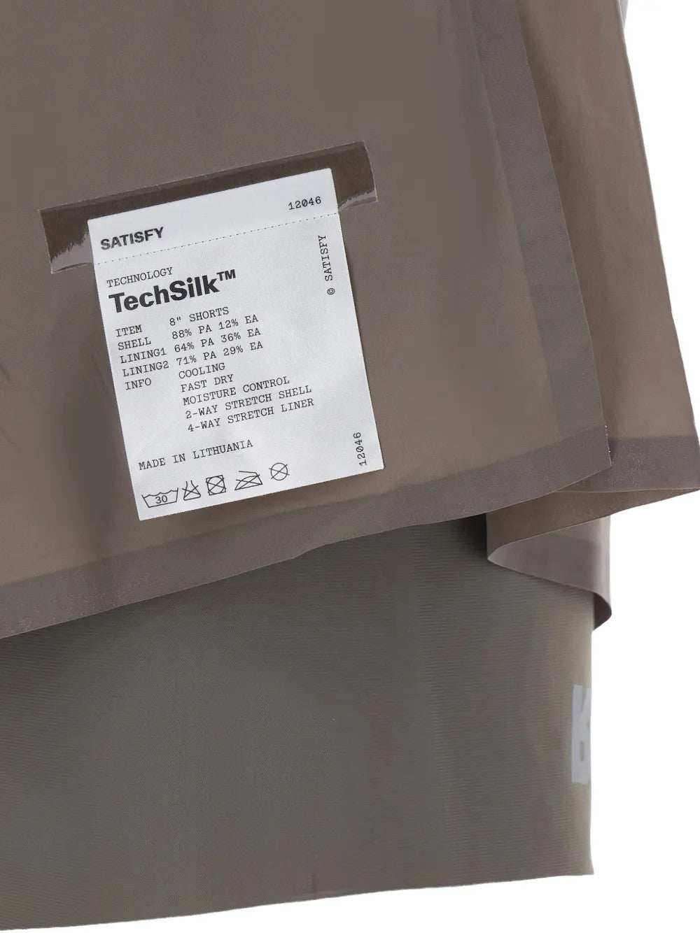 Close up of Tan shorts, showing texture of the 88% polyamide/ 12% elastane fabric