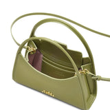 Close up of the green bag, showing texture of the leather fabric