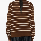 Brown shirt worn by a person, showing the shirt's fit
