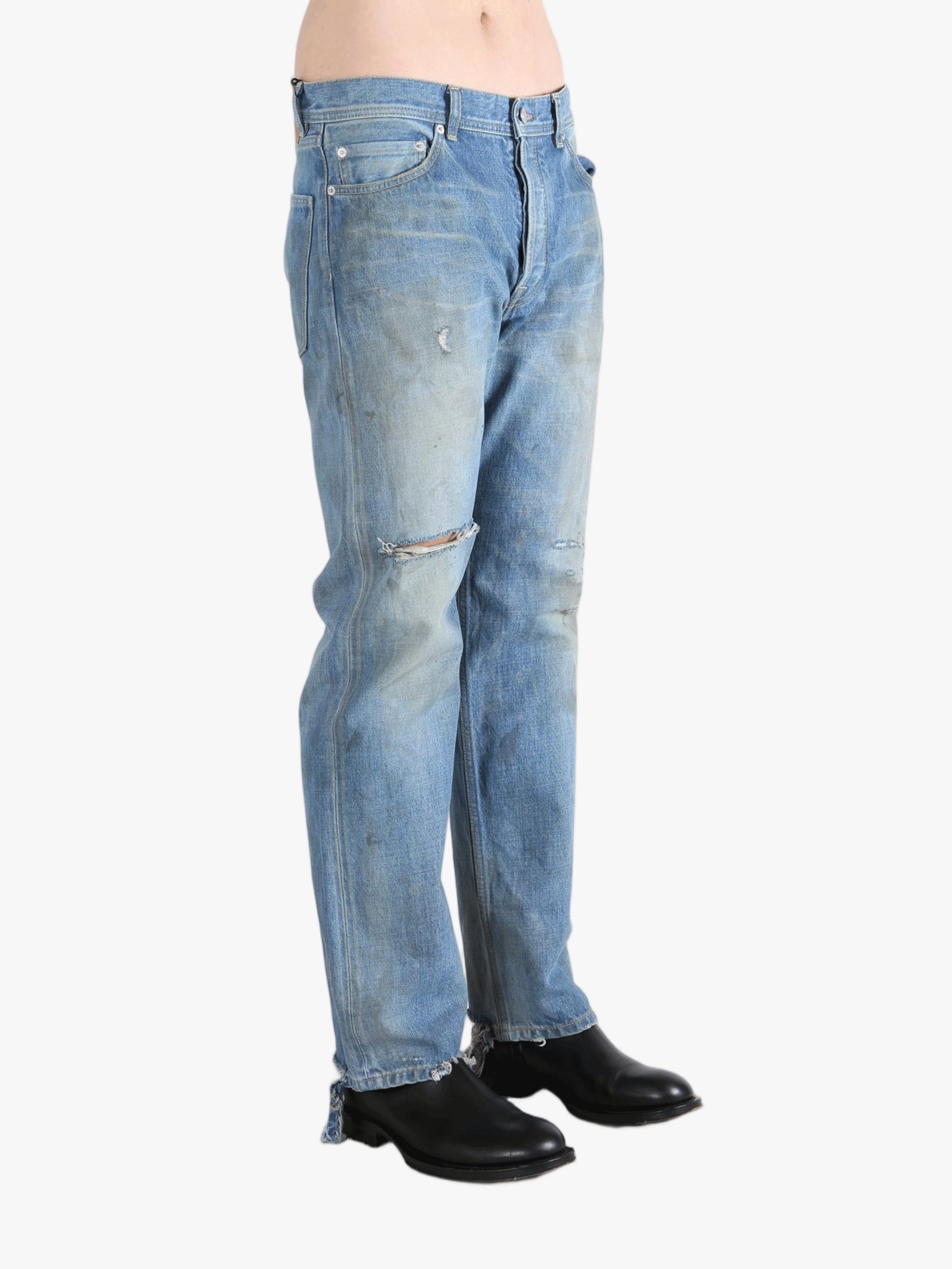 Blue jeans worn by a person, showing the jeans fit