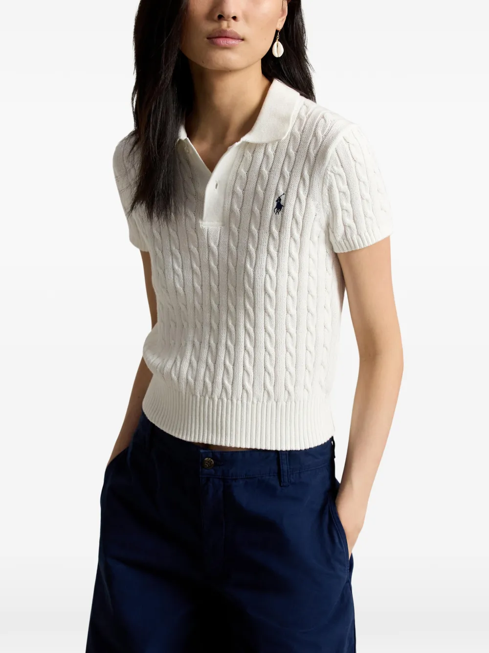 White t-shirt worn by a person, showing the shirt's fit