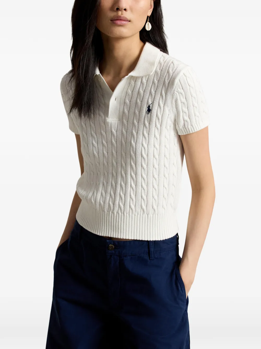 White t-shirt worn by a person, showing the shirt's fit