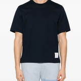 Blue t-shirt worn by a person, showing the shirt's fit