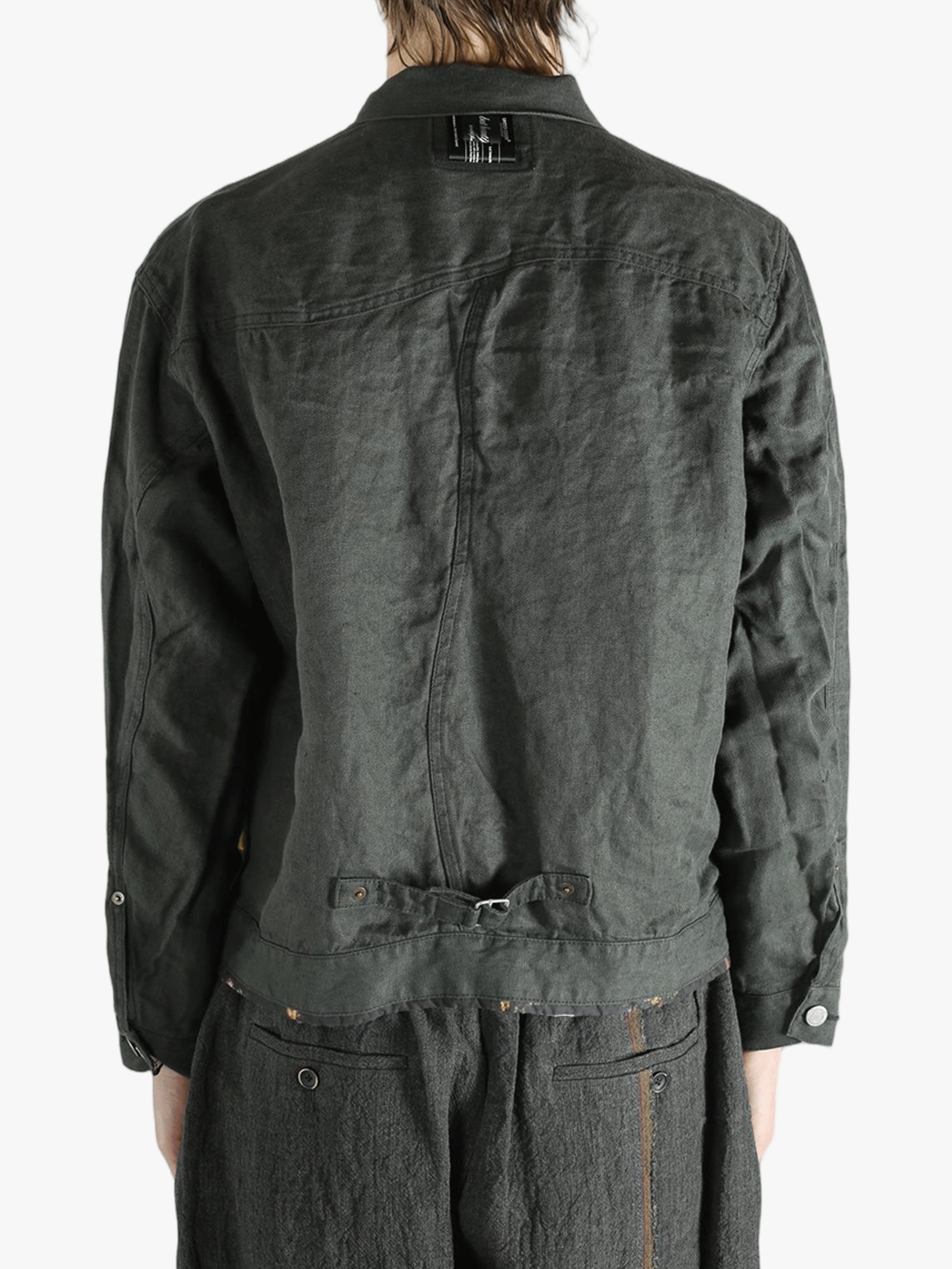 Black jacket worn by a person, showing the jacket's fit