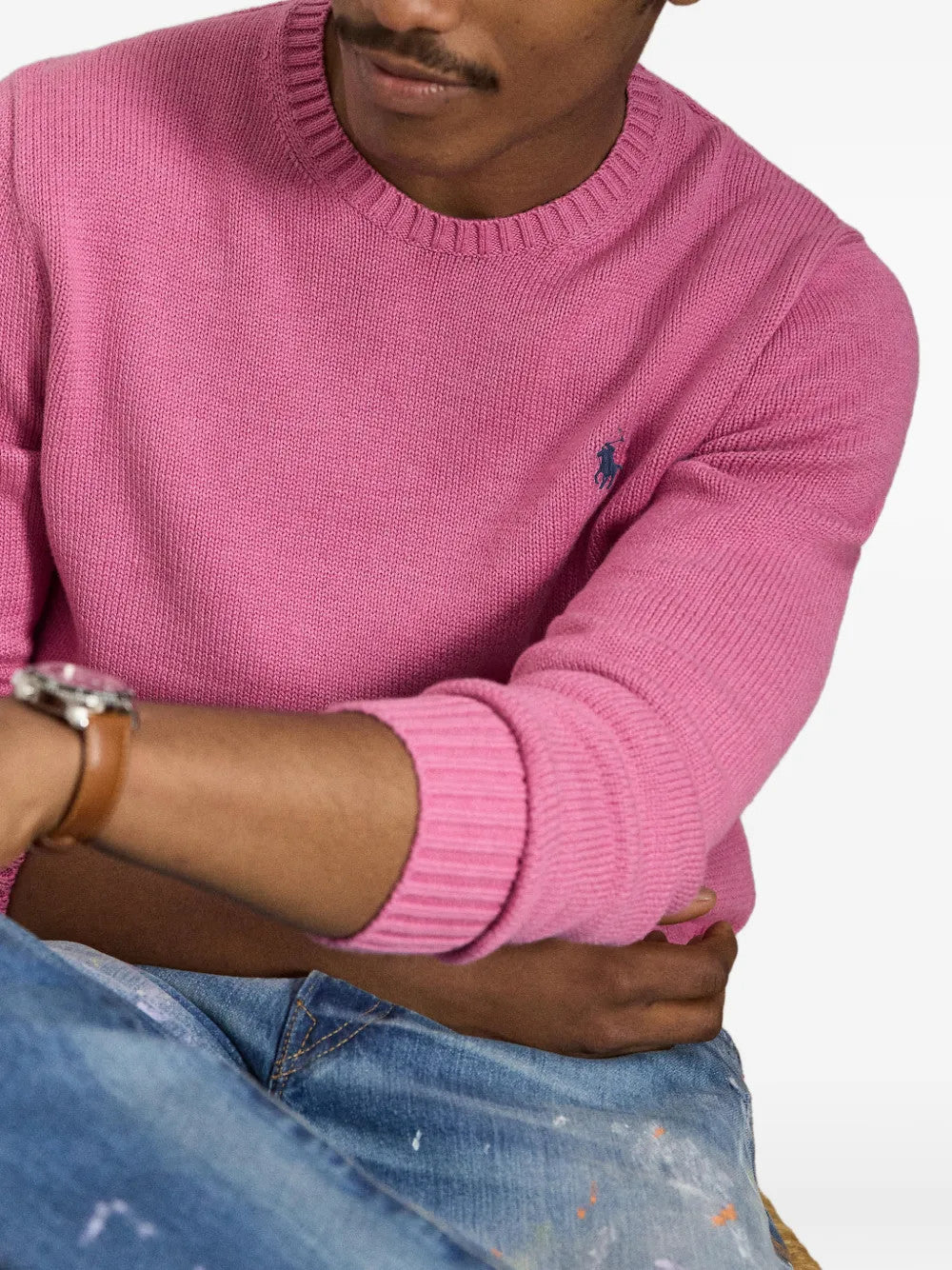 Pink knitwear worn by a person, showing the knitwear fit