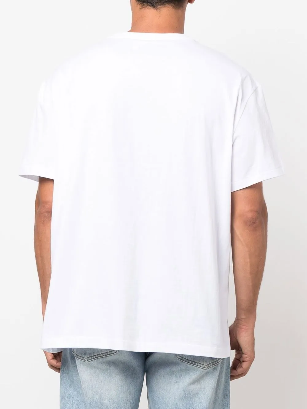 White T-shirt worn by a person, showing the T-shirt's fit