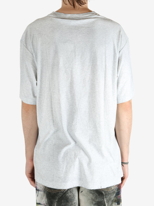 Grey t-shirt worn by a person, showing the shirt's fit