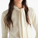 Tan t-shirt worn by a person, showing the t-shirt fit