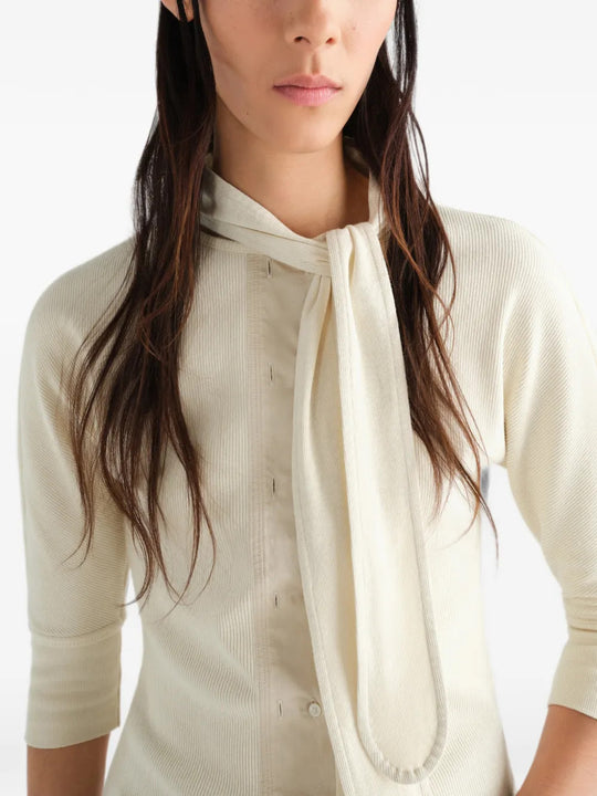 Tan t-shirt worn by a person, showing the t-shirt fit