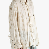 Tan shirt worn by a person, showing the shirt's fit