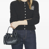 black bag worn by a person, showing the bag fit