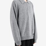 Grey top worn by a person, showing the top fit