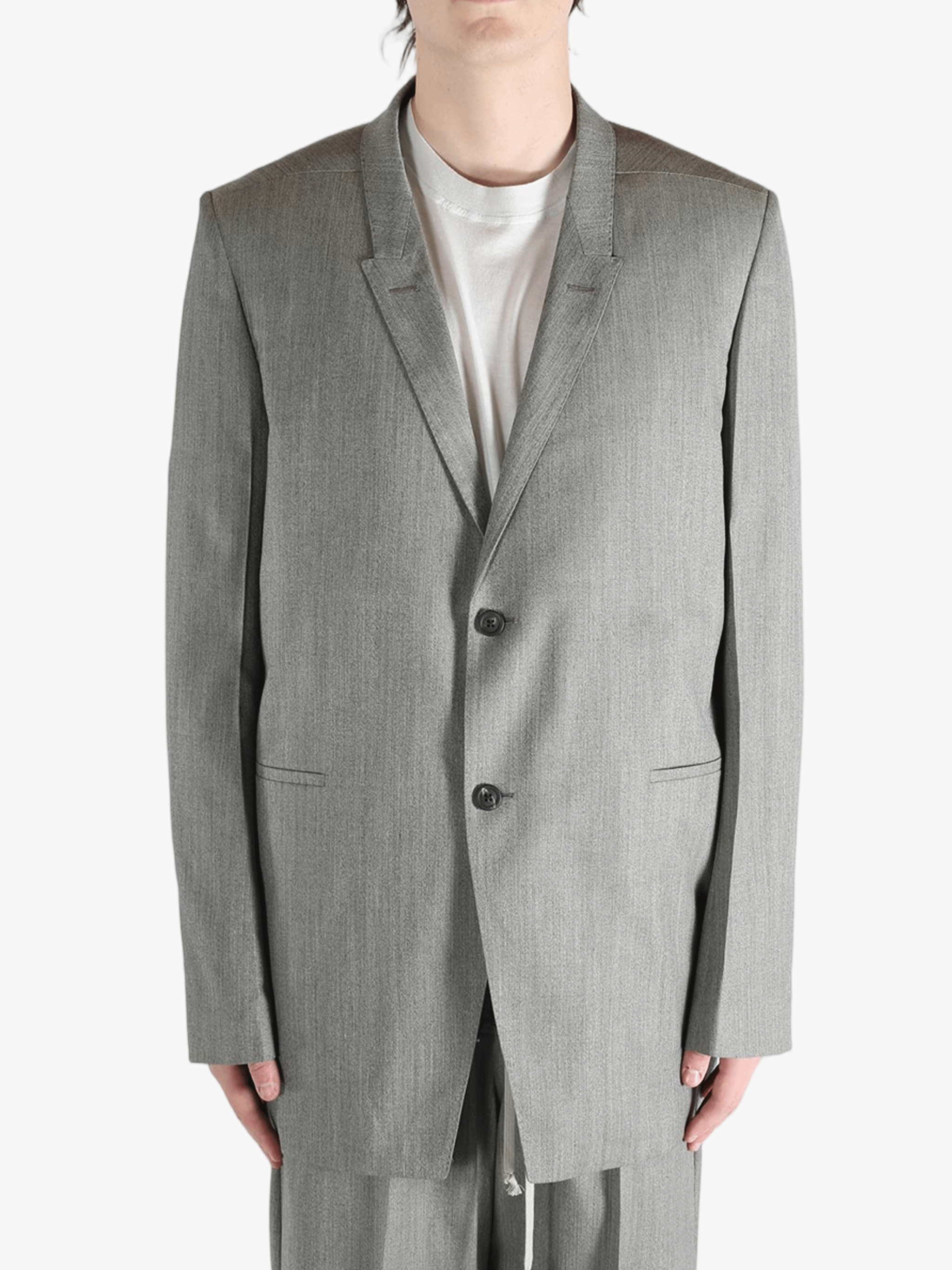 Grey jacket worn by a person, showing the jacket's fit