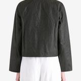 Green jacket worn by a person, showing the jacket fit