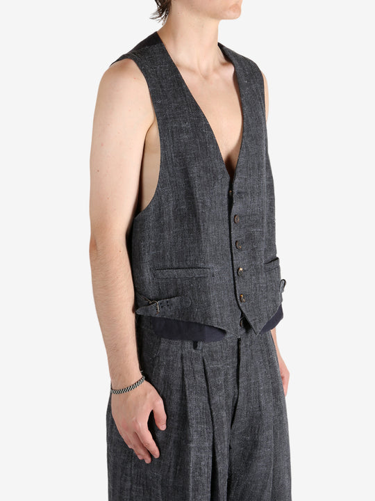 Grey waistcoat worn by a person, showing the waistcoat fit