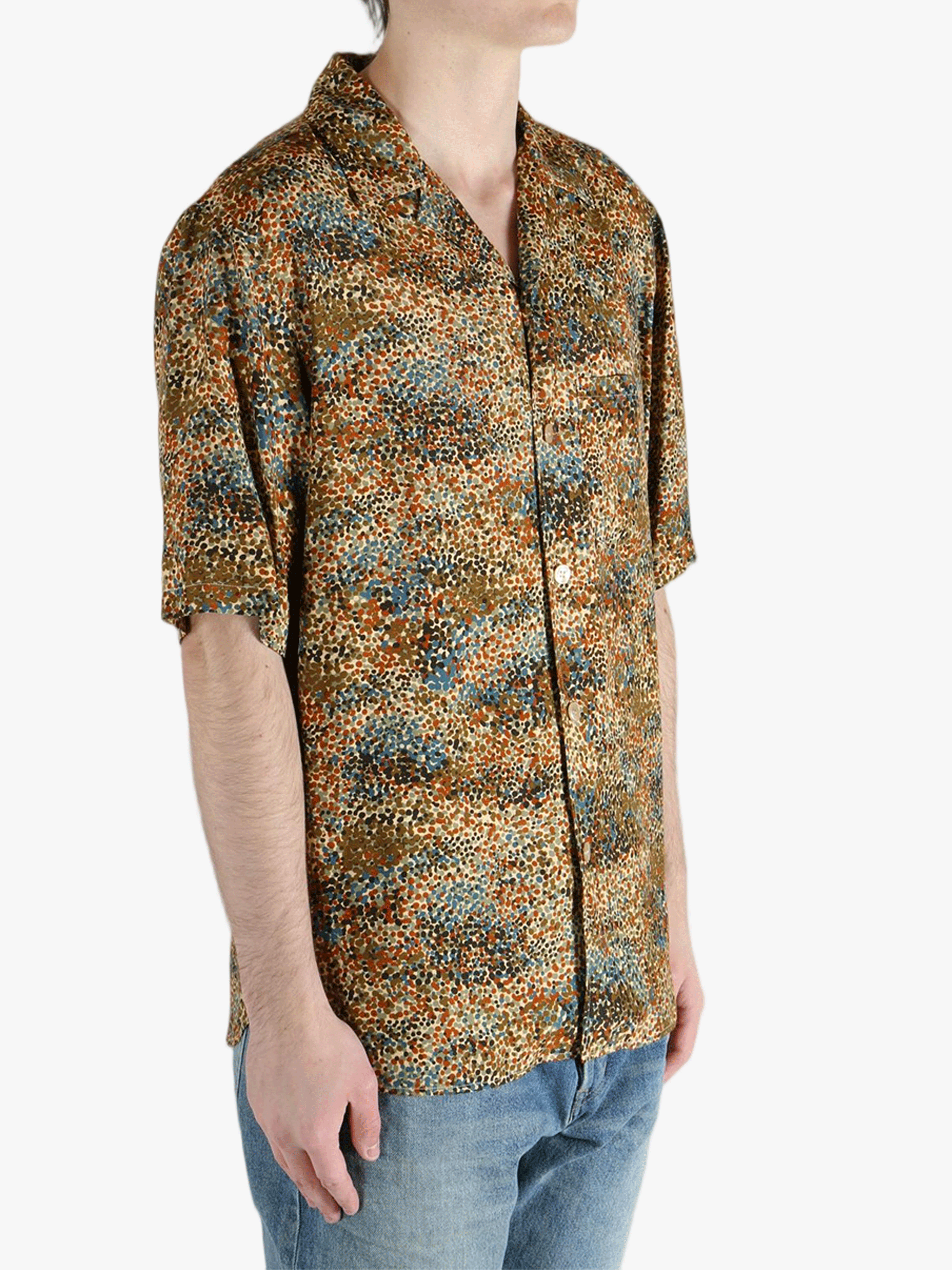 Tan shirt worn by a person, showing the fit