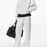 White pants worn by a person, showing the pants fit