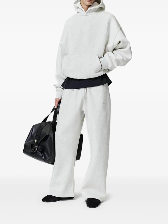 White pants worn by a person, showing the pants fit
