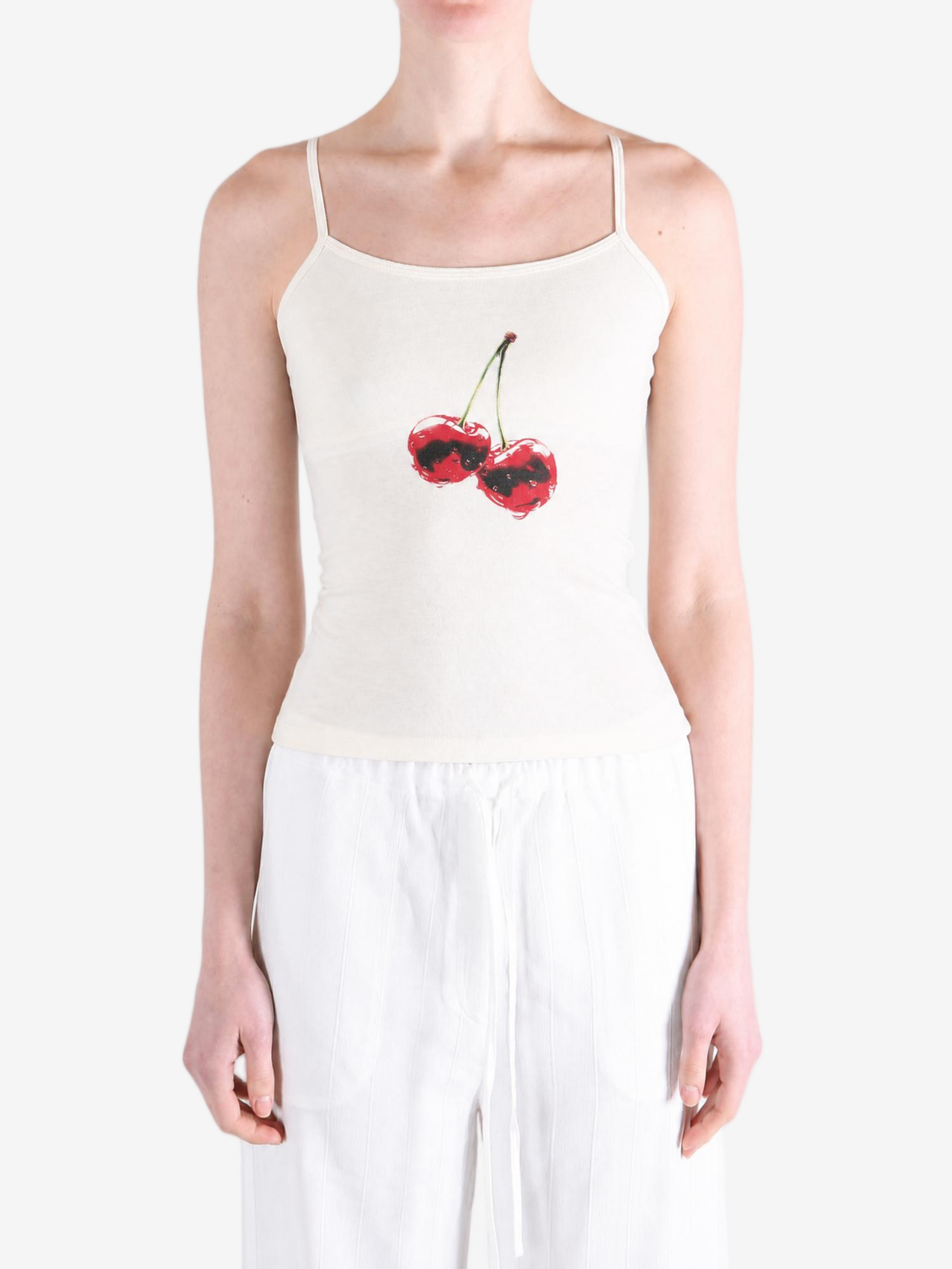 White top worn by a person, showing the top fit