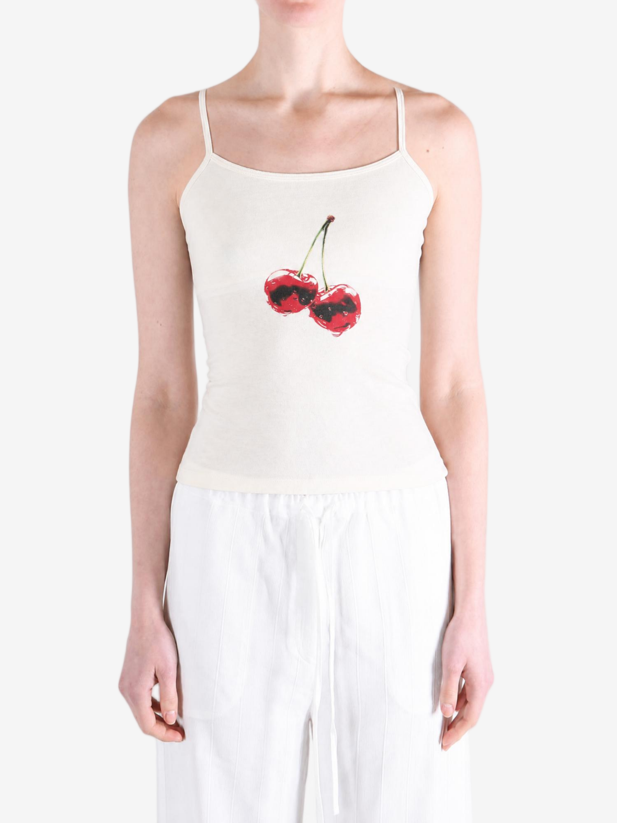 White top worn by a person, showing the top fit
