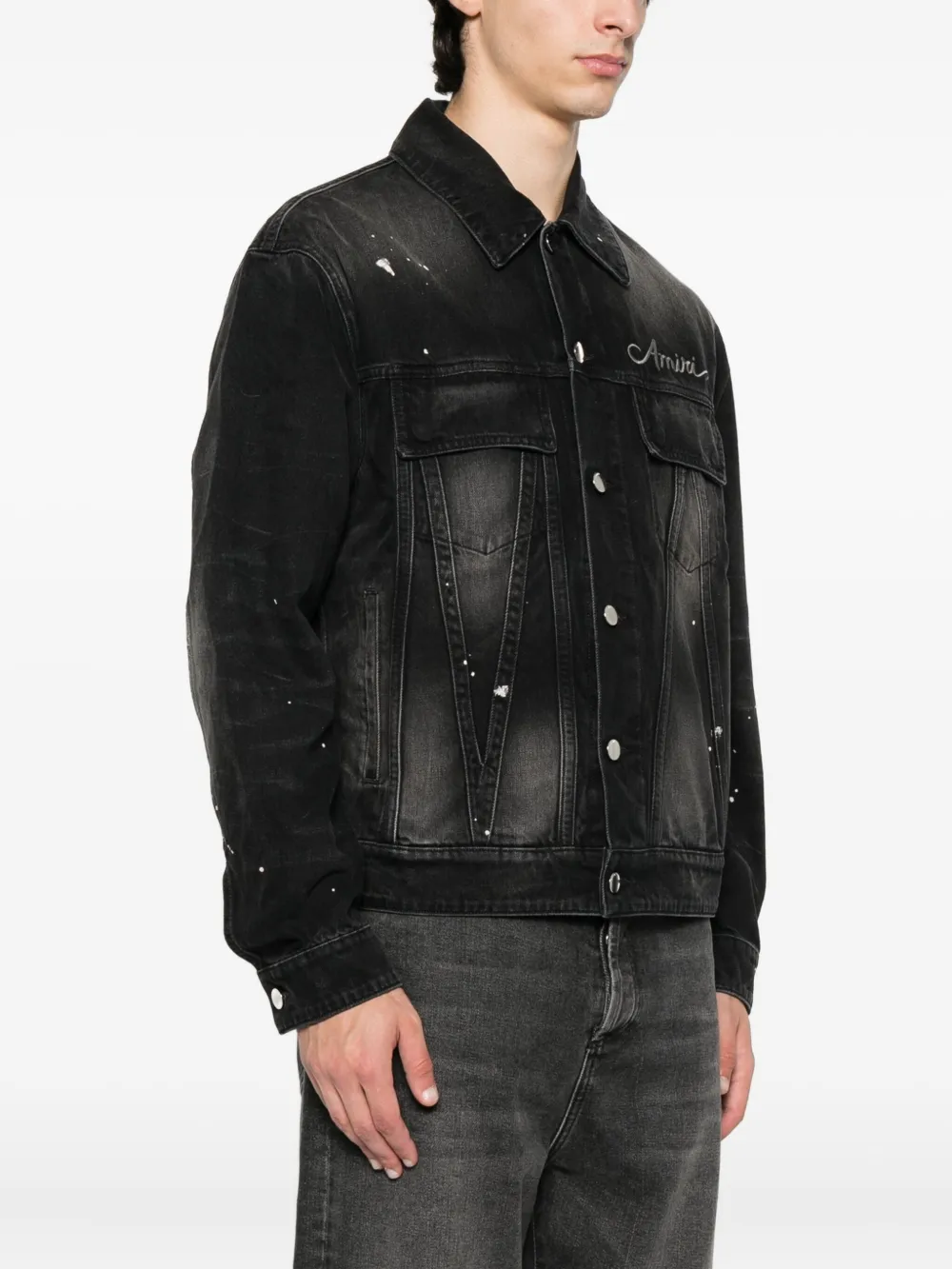 Black jacket worn by a person, showing the jacket's fit