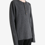 Grey top worn by a person, showing the top fit