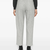 Grey pants worn by a person, showing the pants fit