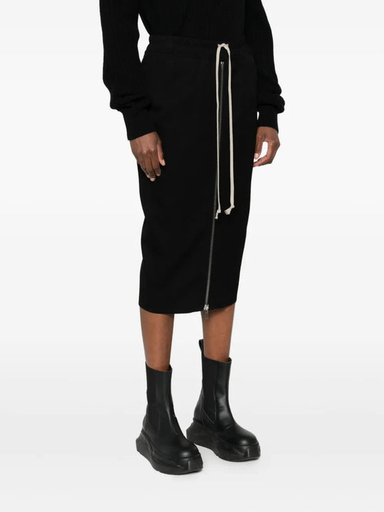 Black skirt worn by a person, showing the skirt's fit