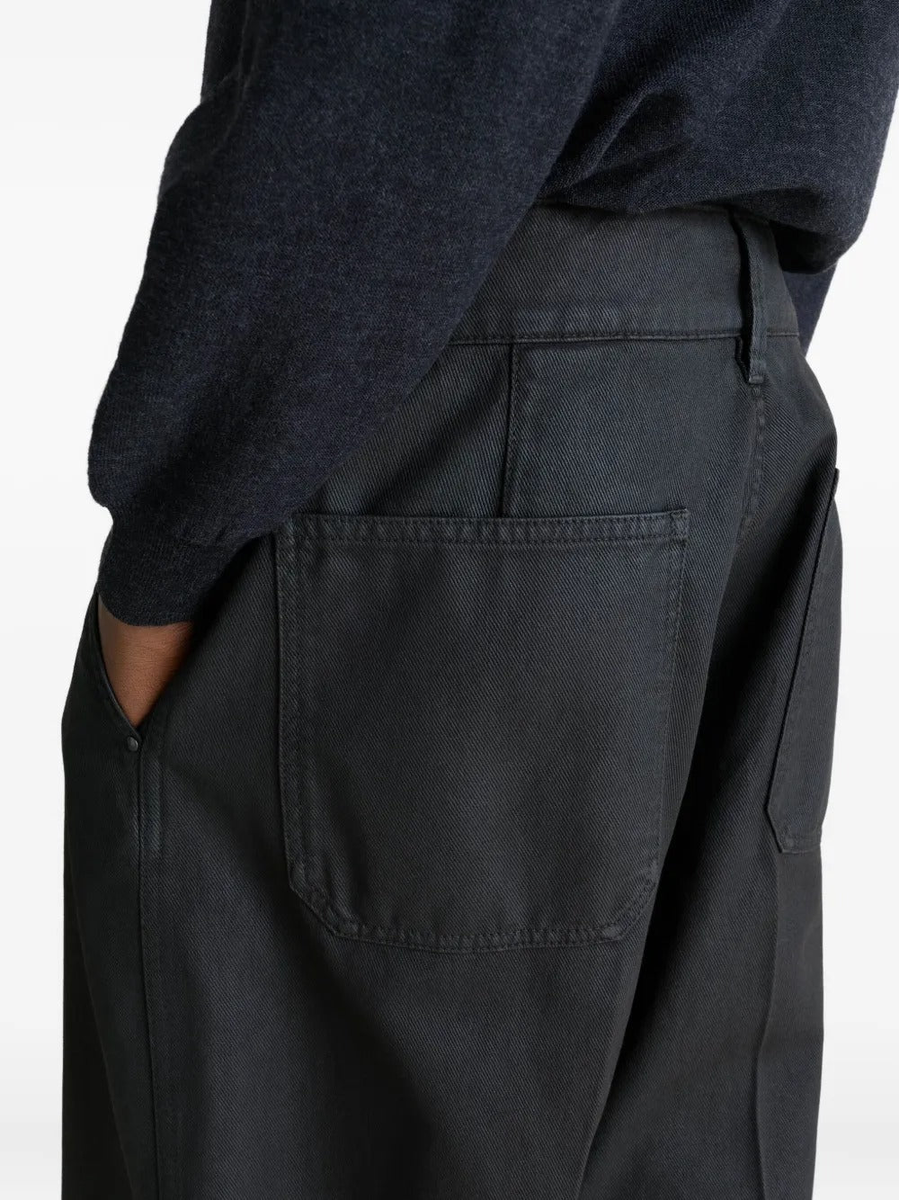 Close up of black pants, showing texture of the cotton fabric