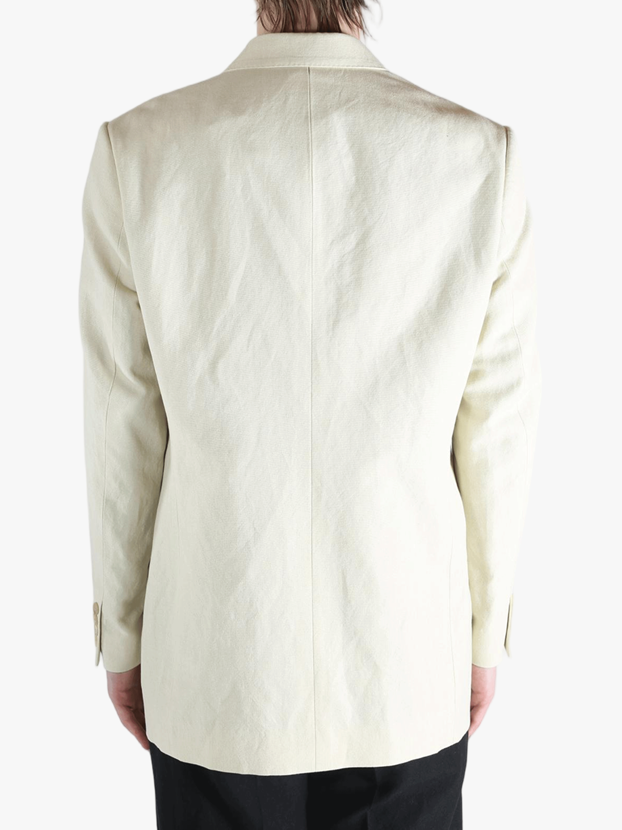 White jackets worn by a person, showing the jackets fit