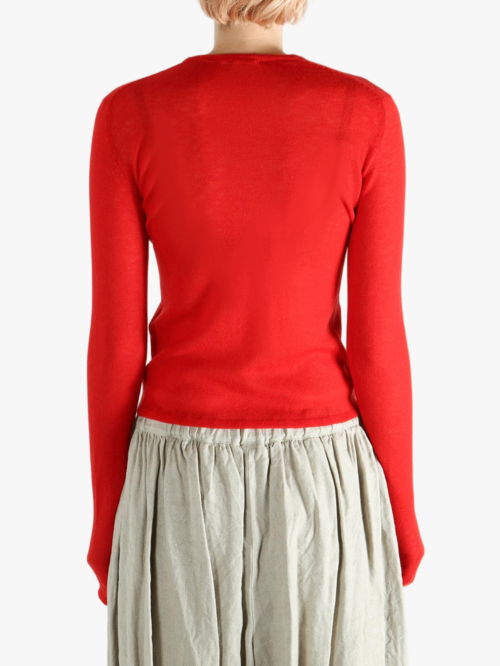 Red knitwear worn by a person, showing the knitwear's fit
