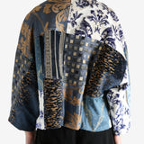 Blue coat worn by a person, showing the coat fit