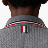 Grey jacket worn by a person, showing the jacket fit