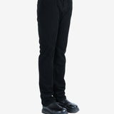 Black pants worn by a person, showing the pants's fit