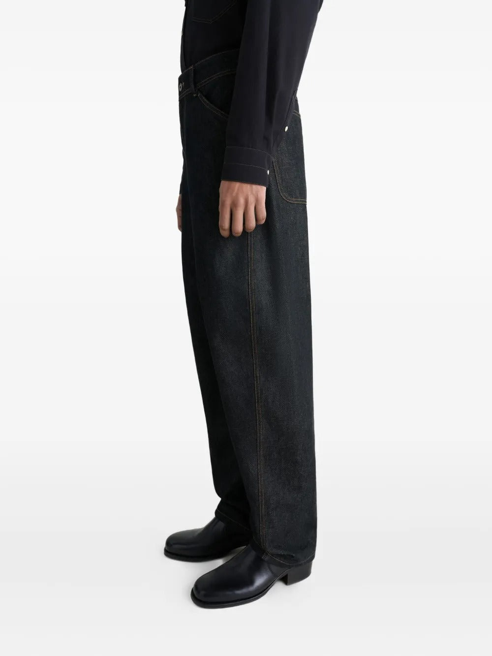 Navy pants worn by a person, showing the pants' fit
