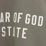 Close up of the green sweatshirt, showing texture of the cotton fabric