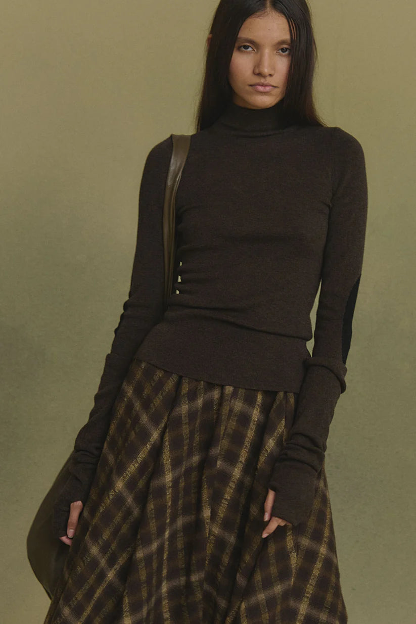 Brown jumper worn by a person, showing the jumper's fit
