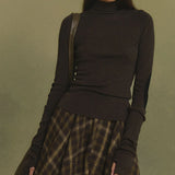 Brown jumper worn by a person, showing the jumper's fit
