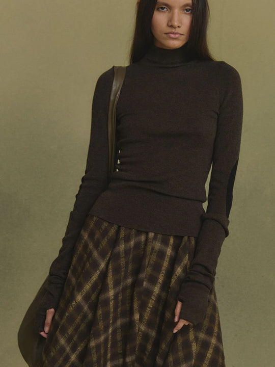 Brown jumper worn by a person, showing the jumper's fit