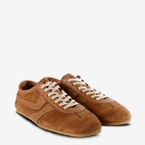 Tan sneakers, side view